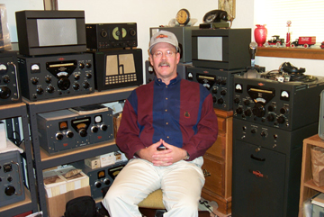 Picture of Charlie with various radios in his CQ room. The CQ room got it's name from our daughter when she was about 2 or 3 years ago. She kept hearing him call CQ, CQ, CQ.